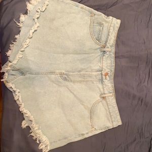 High waste button light wash shorts